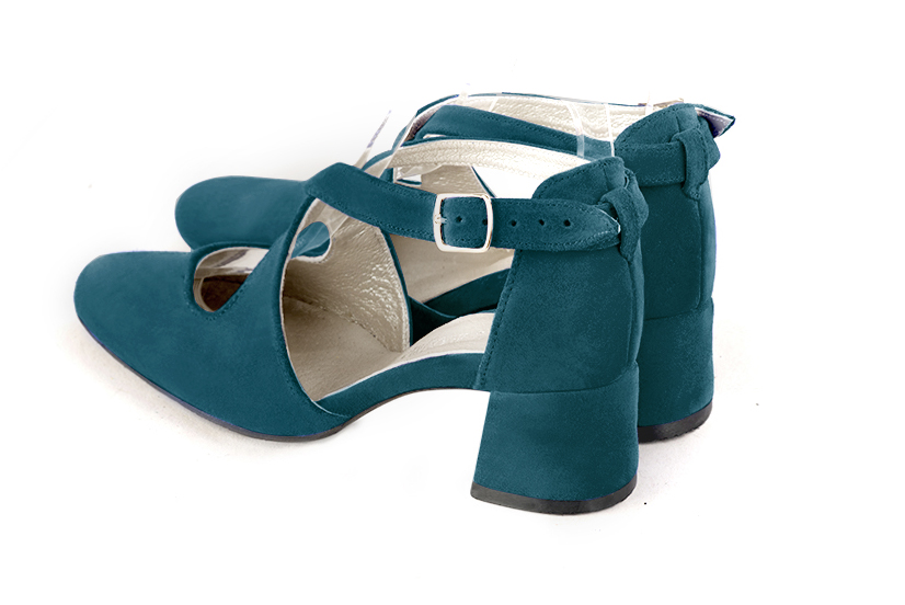 Women's peacock blue elegant closed-back heels, with crossed straps. .  - Rear view